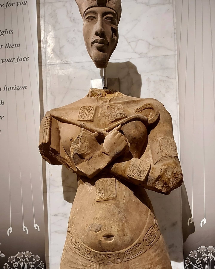 Close-up of a weathered ancient statue.