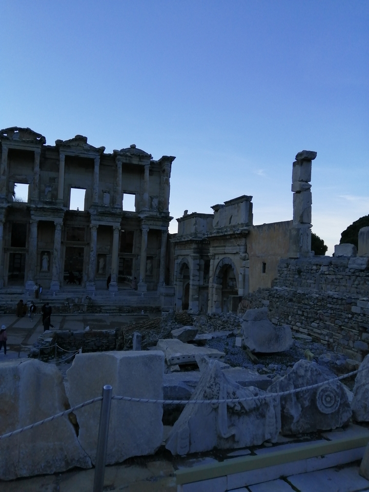 Ruins of an ancient library structure at dusk