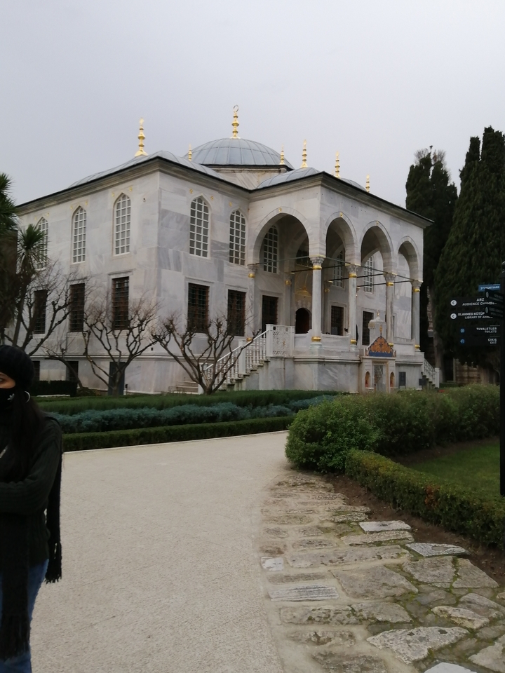 Exterior of a historical building with a garden