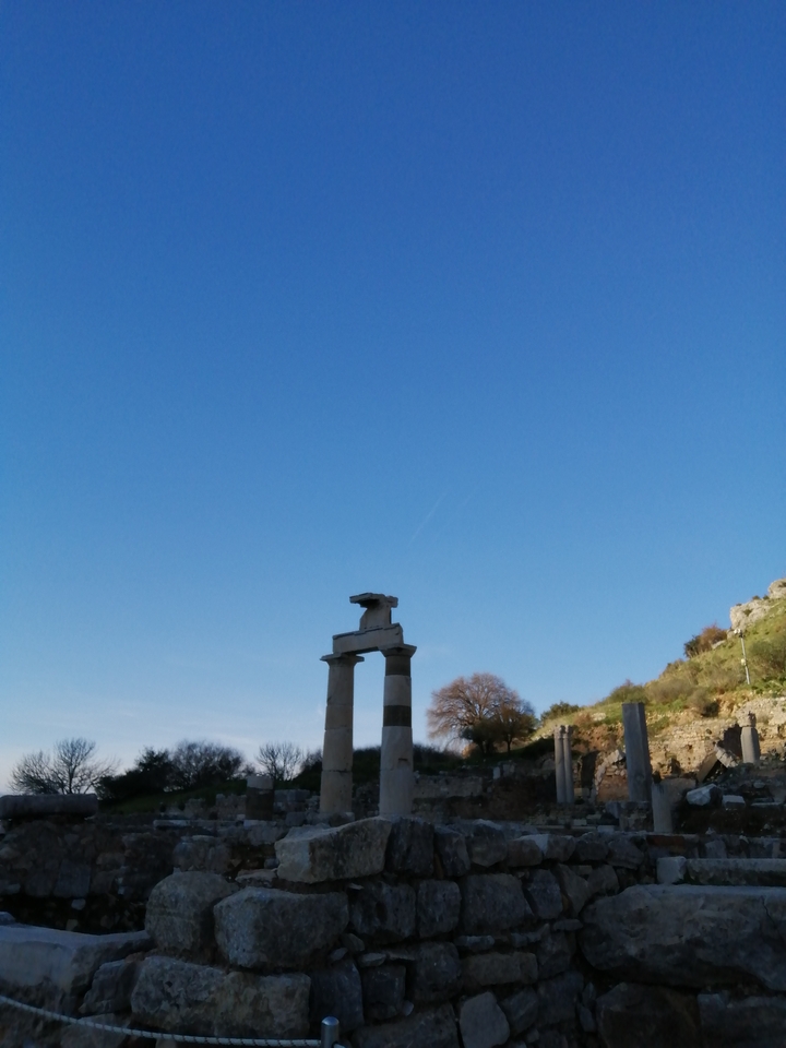 Two ancient columns from a temple ruin against the sky