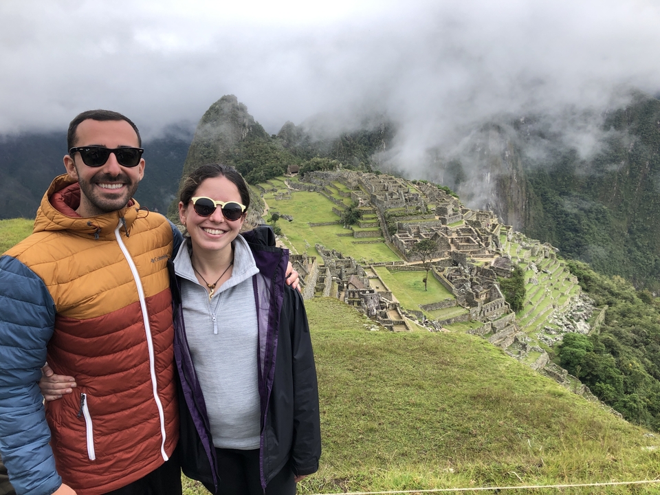 Couple posing in front of Machu Picchu.