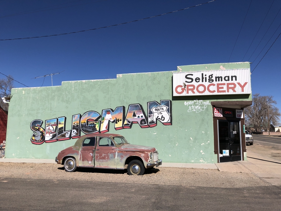 Seligman Route 66 grocery store with vintage car.