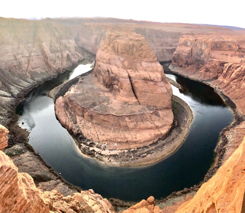 Horseshoe Bend with river surrounding the land.