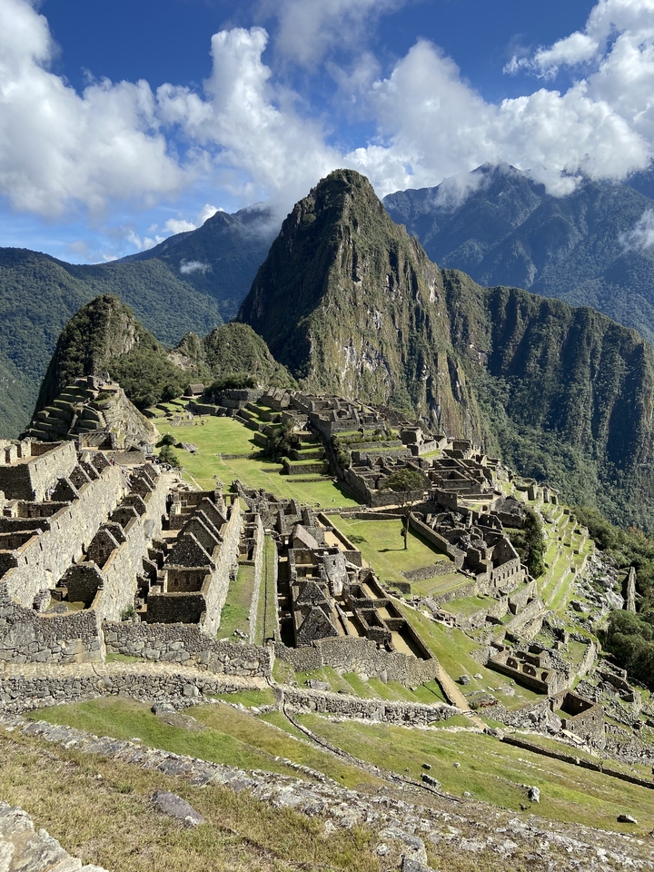 Overhead view of Machu Picchu set against mountainous terrain.