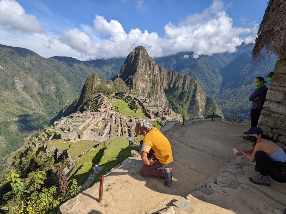 A person viewing Machu Picchu from a vantage point.