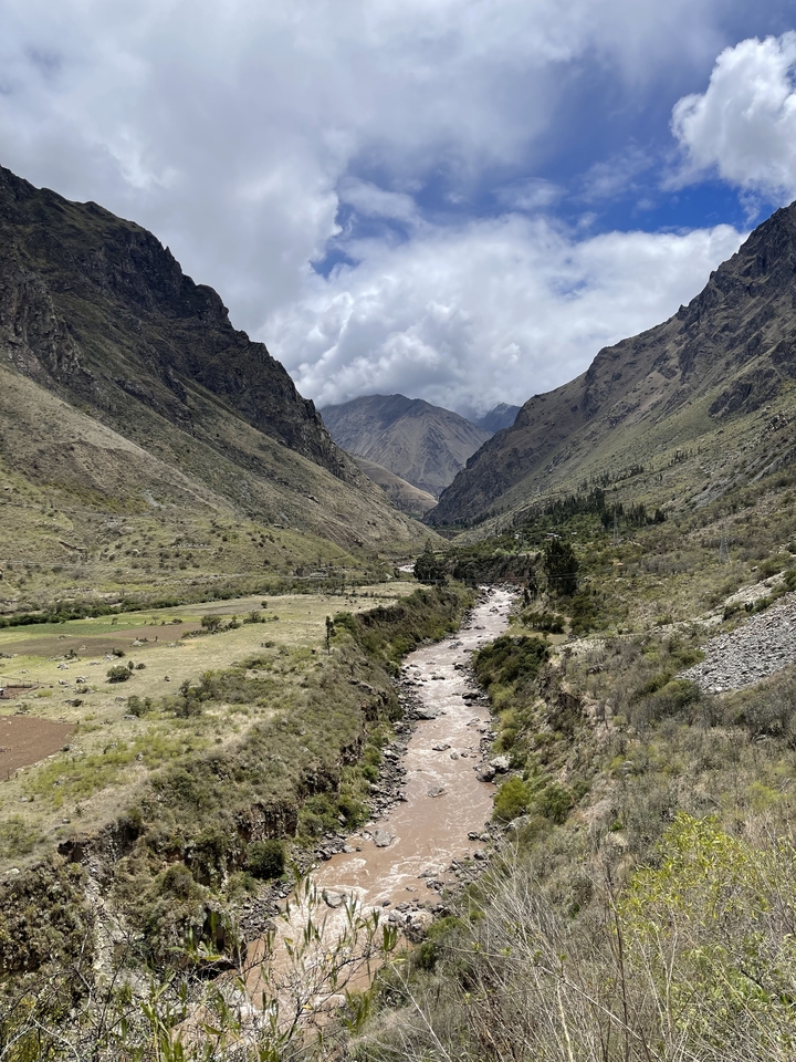 A river snaking through a densely vegetated valley.