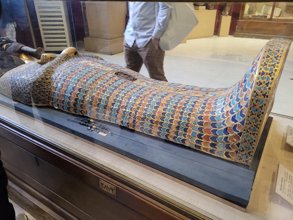 Colorful ancient Egyptian sarcophagus on display.