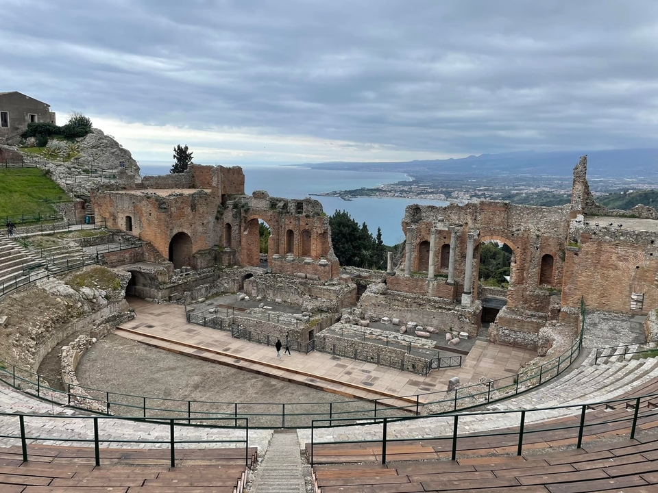 Ancient Roman amphitheater overlooking the sea.