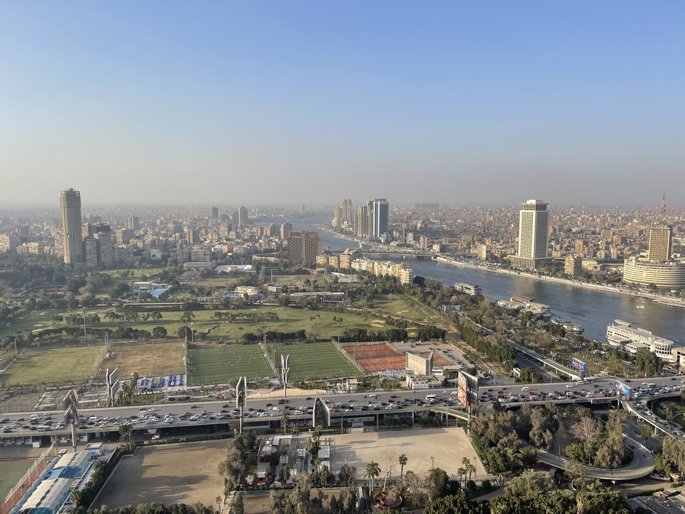 Aerial view of a city with the Nile River passing through it.