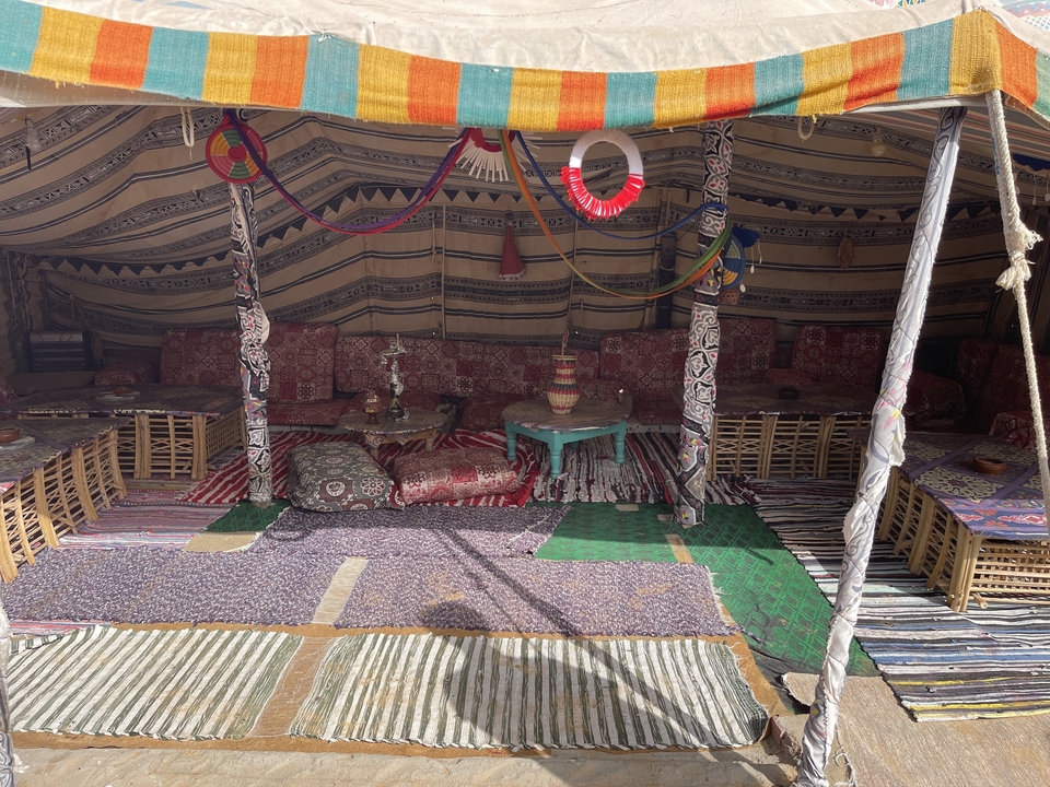 Interior of a traditional tent with colorful decor.