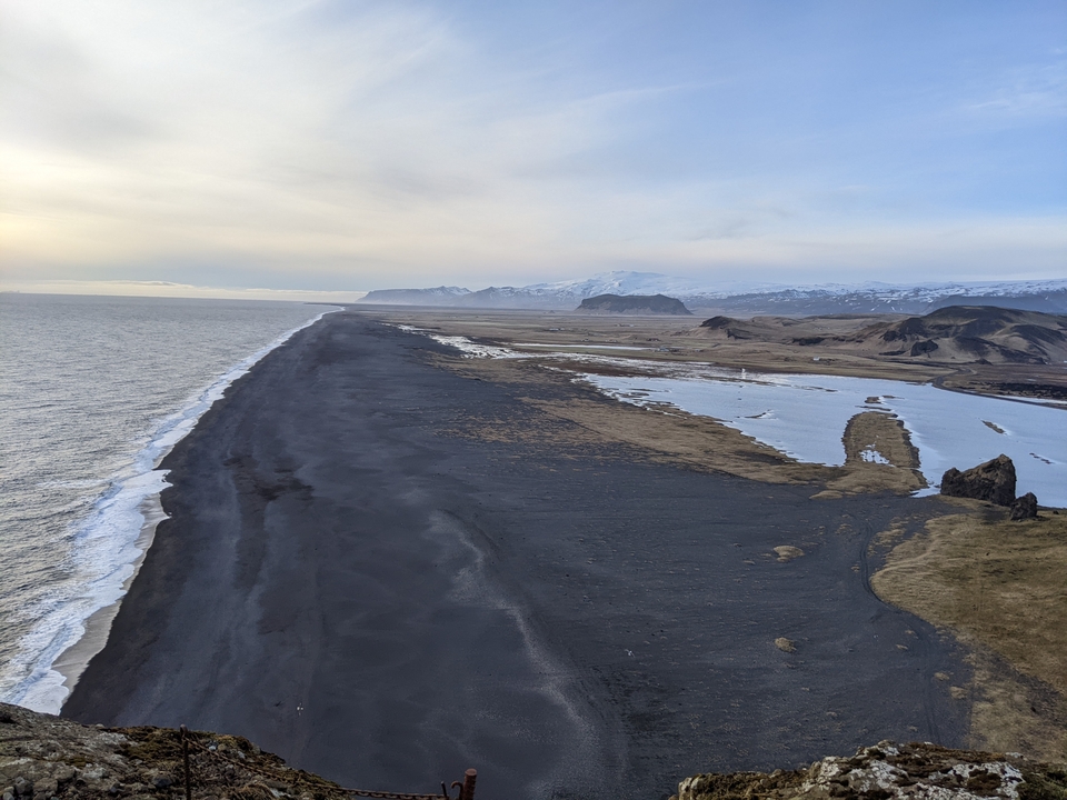Vast coastal landscape with sandy beaches and ocean.