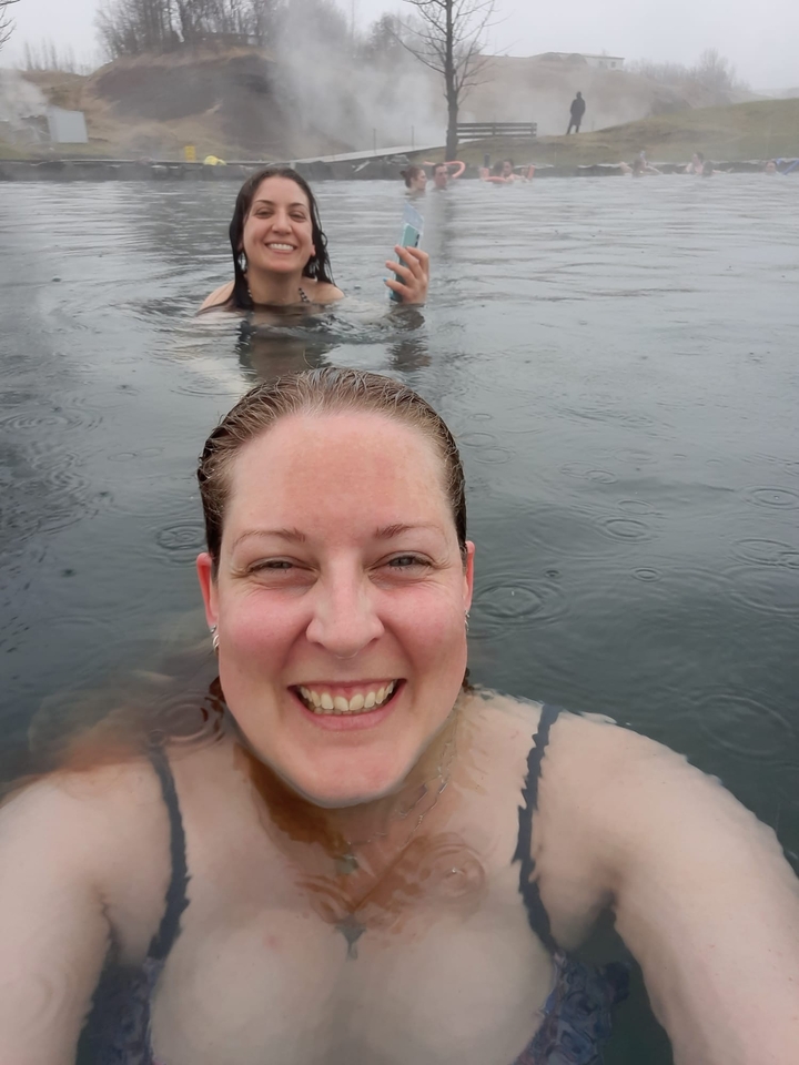 Smiling woman in a hot spring.