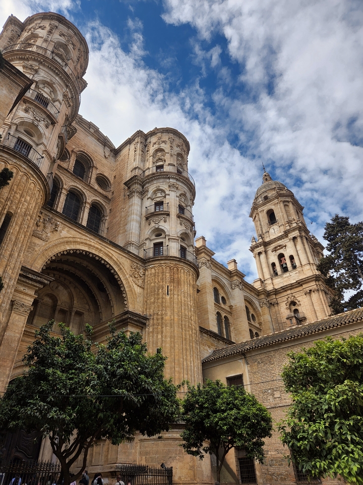 Historic cathedral exterior under a blue sky.
