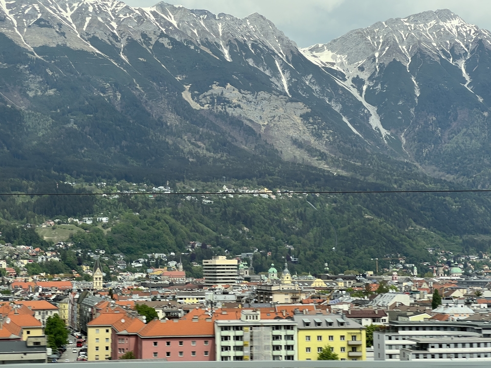 Cityscape with mountains in the distance.