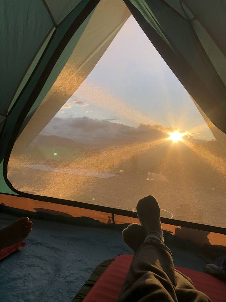 Sunset view from inside a tent.