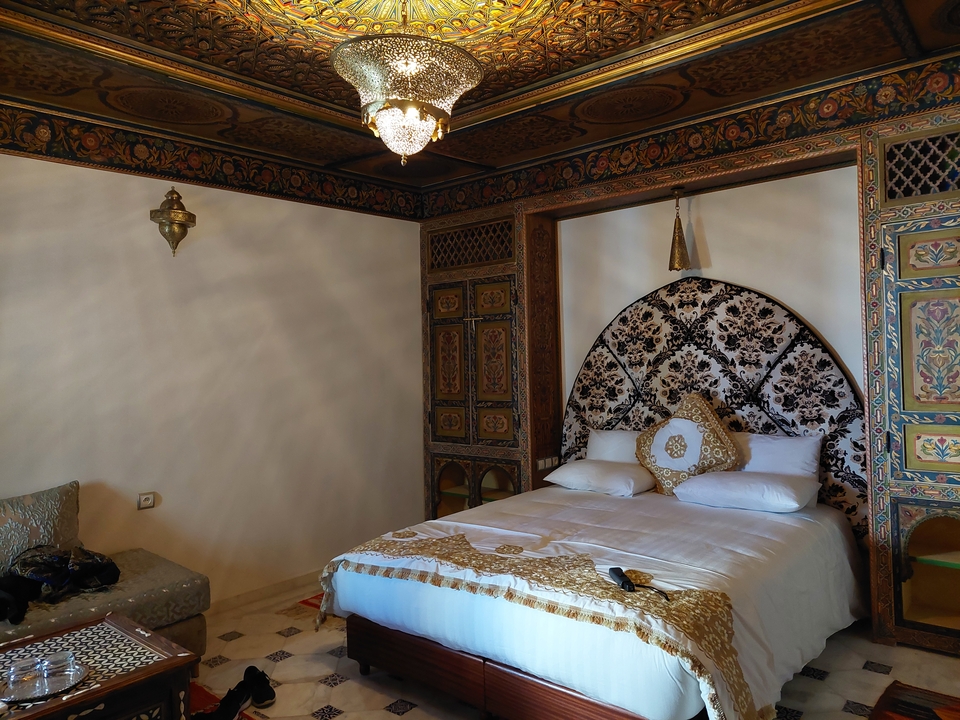 Elegantly decorated interior of a bedroom in a Moroccan style.