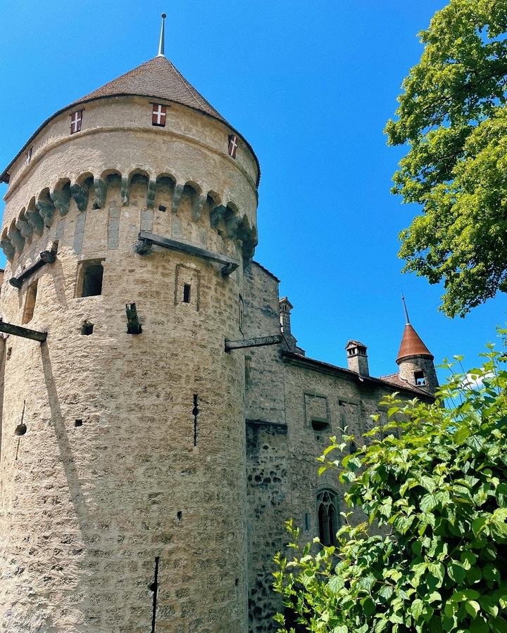 A stone tower with a blue sky background.