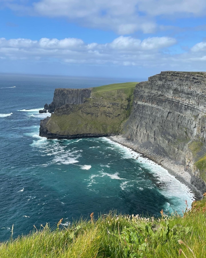 Famous cliff view with astonishing ocean waves crashing against the rocks
