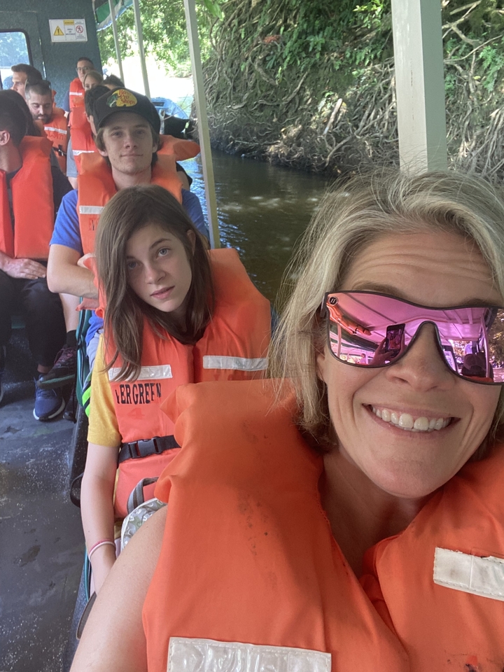People wearing life jackets on a boat