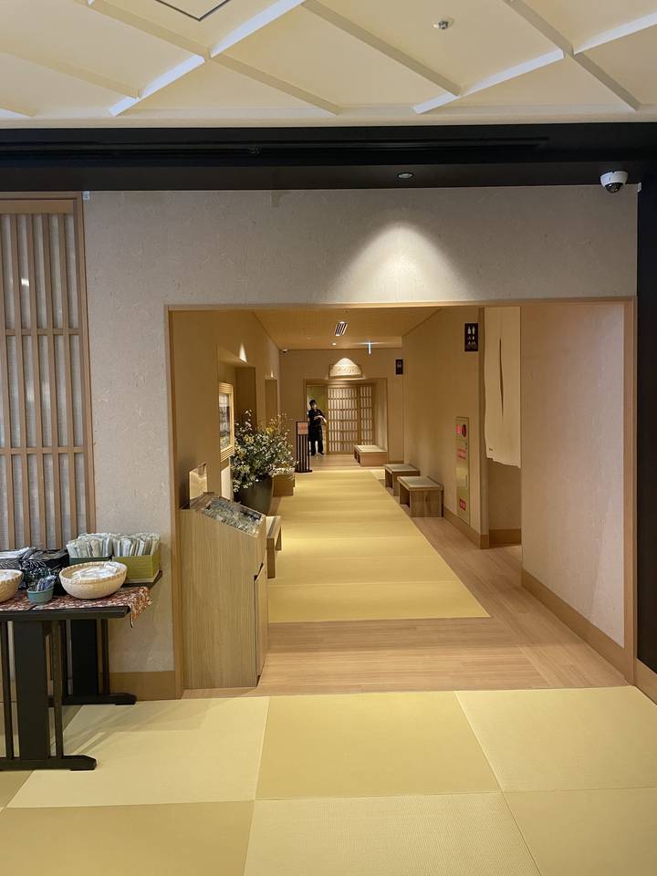 Japanese-style hotel corridor with tatami flooring.