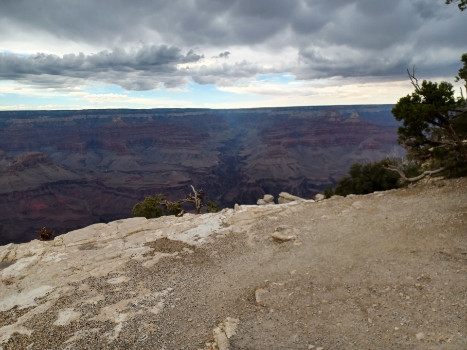 Blurry view of a canyon with dramatic skies.