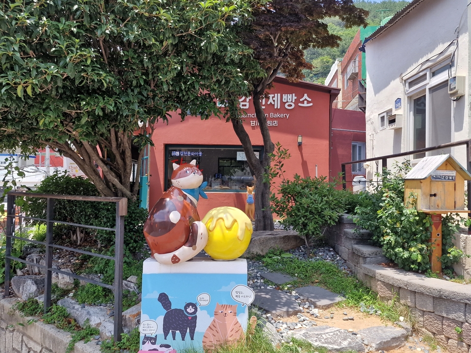 Colorful sculptures near a bakery.