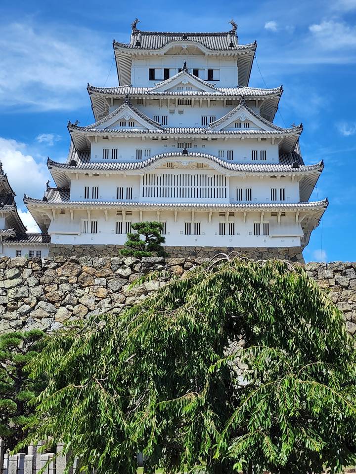 Japanese castle with clear blue sky background.