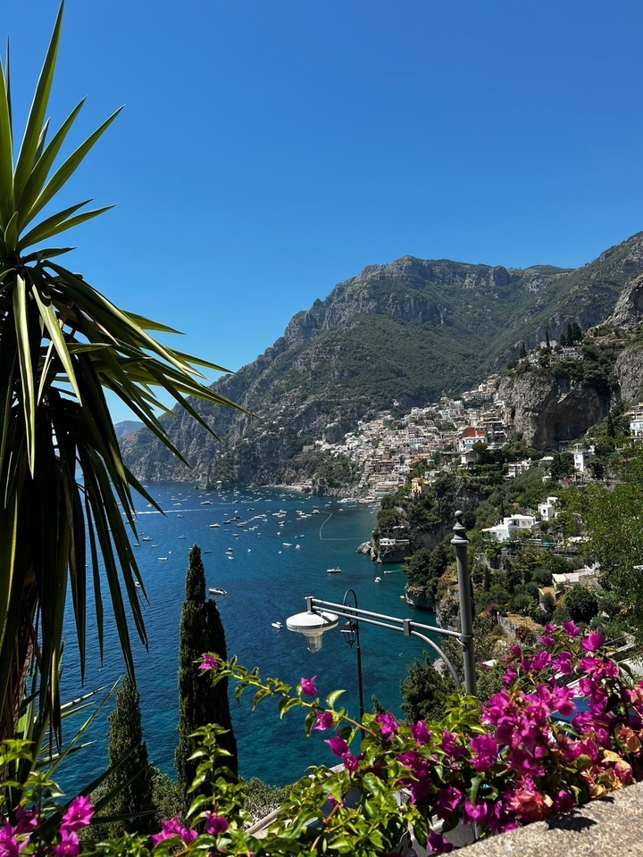 Picturesque view of a coastline with a hillside village in Positano.