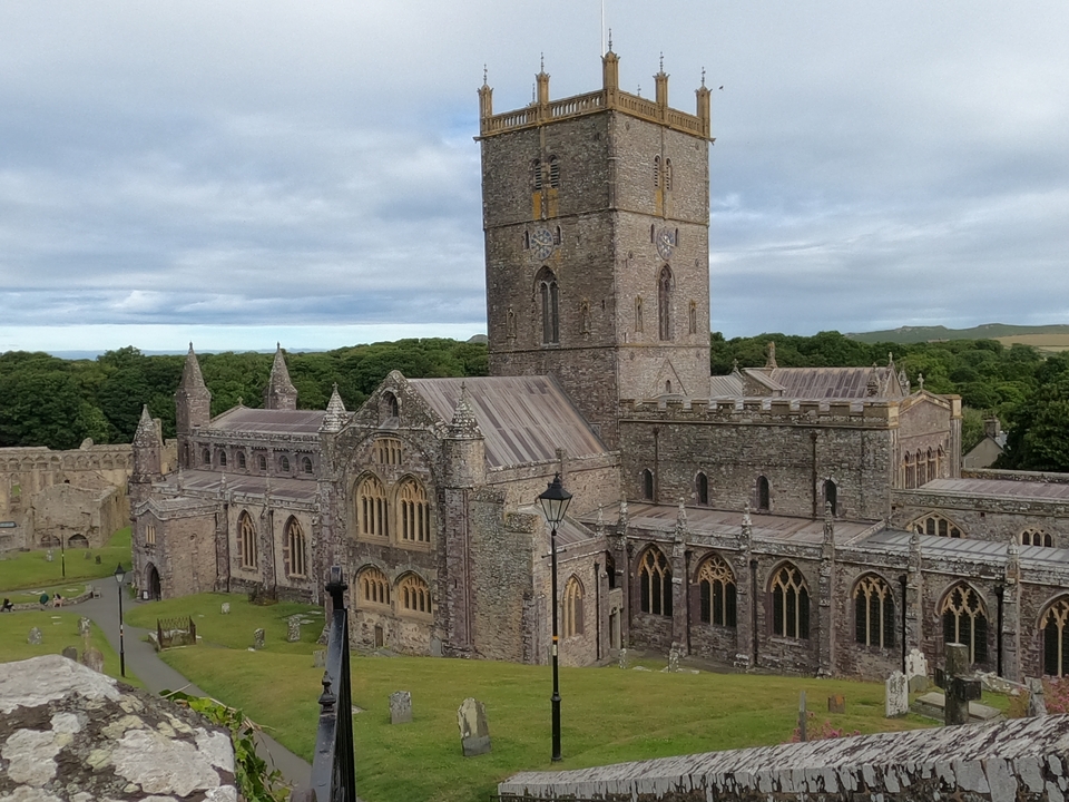 Stone cathedral with clock tower and arched windows