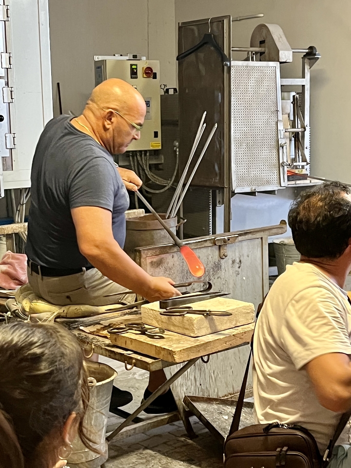 Artisan at work crafting glass