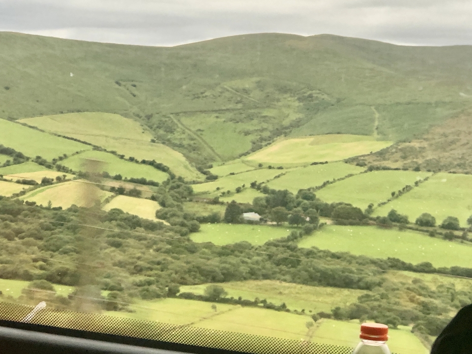 Agricultural fields in a green valley.