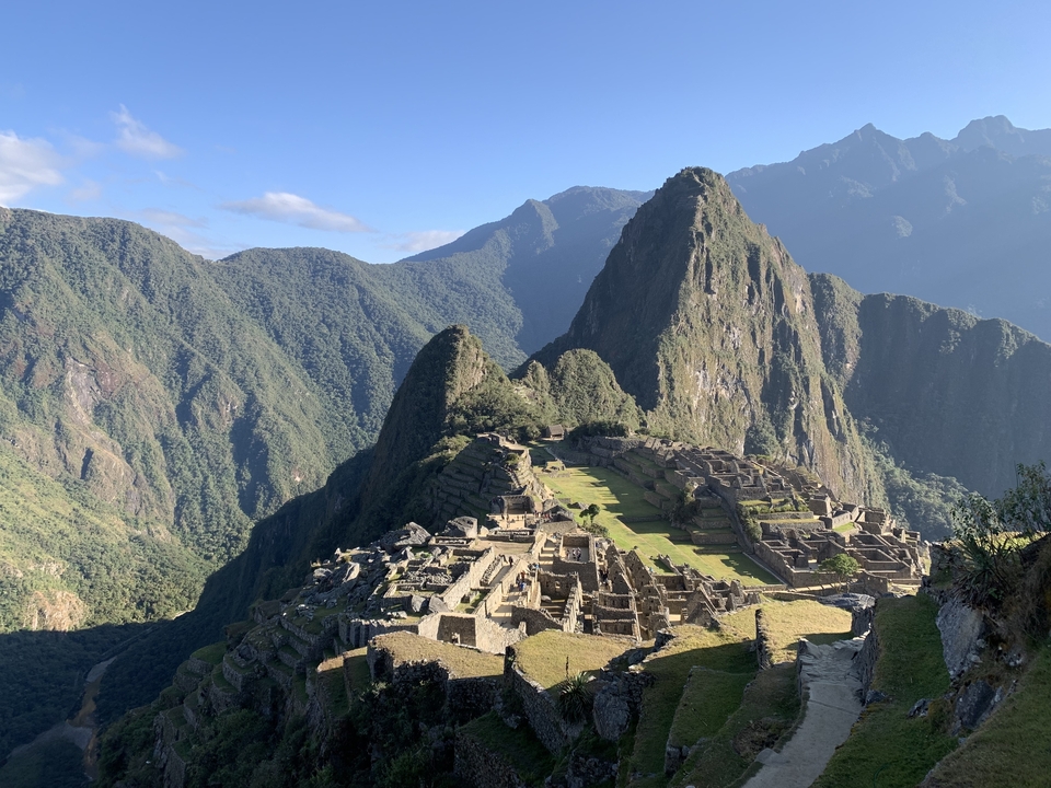 Stunning landscape of Machu Picchu with mountains in the background.