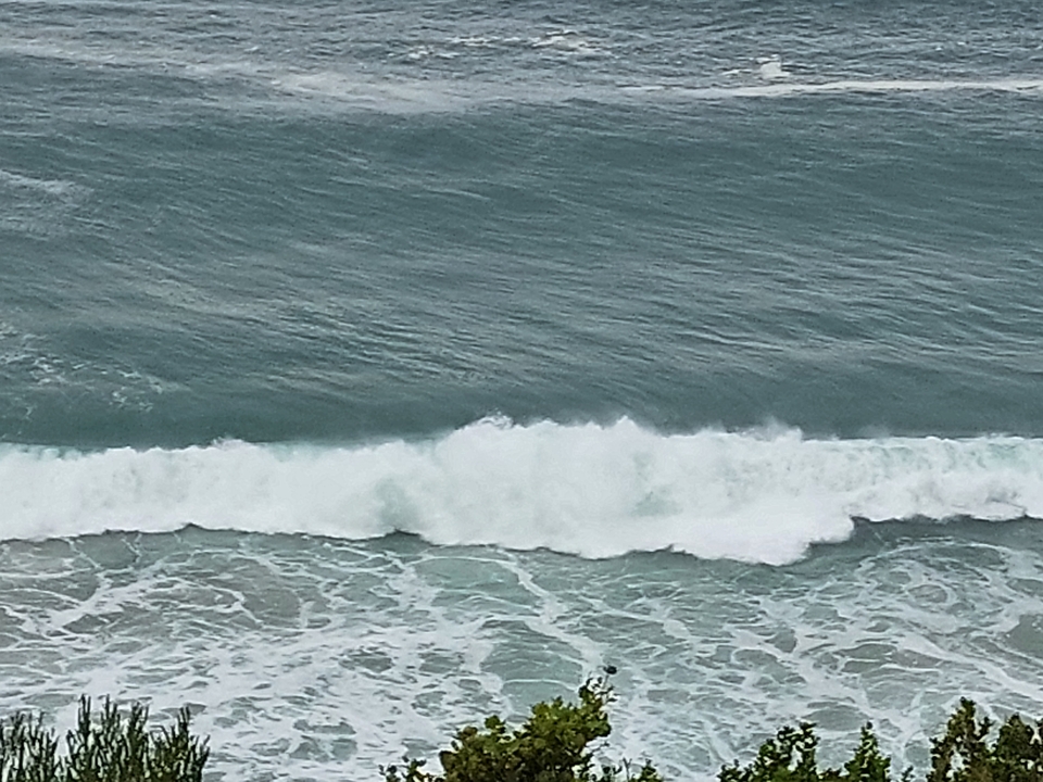 Waves crashing in the ocean.