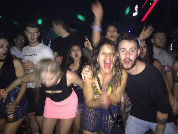 People enjoying a party, photo is upside down.