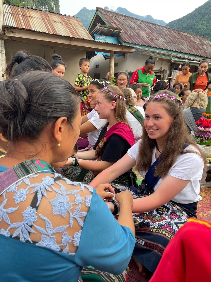 People engaged in a traditional cultural interaction.