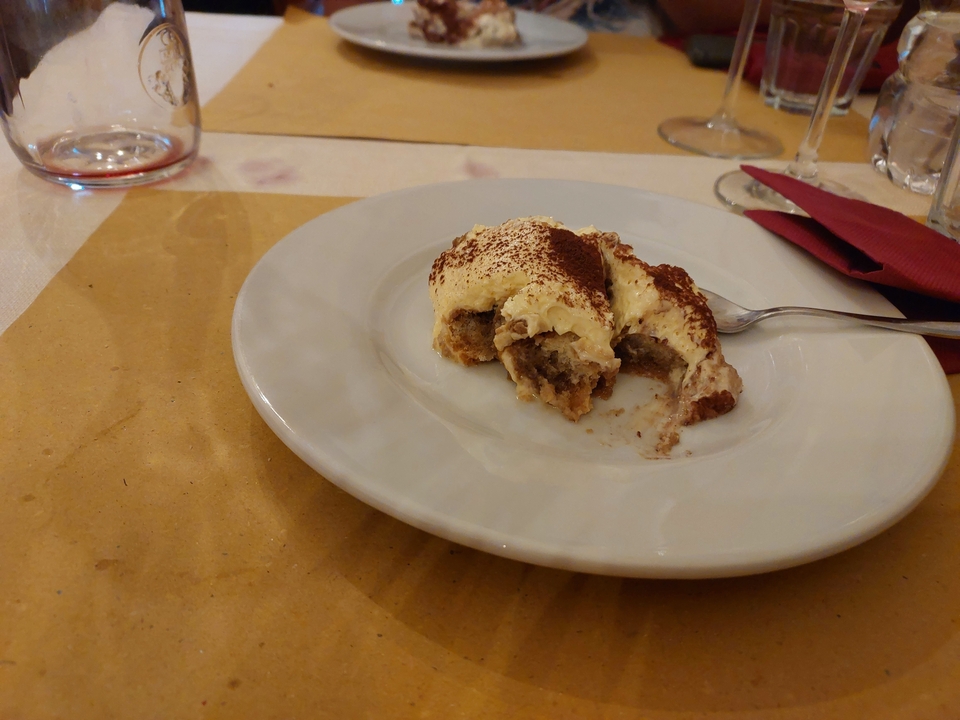 A plate of tiramisu on a table.