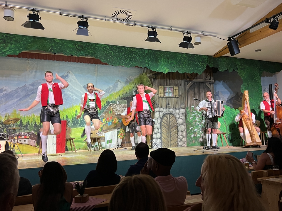 Traditional Bavarian folk performance with musicians and dancers.