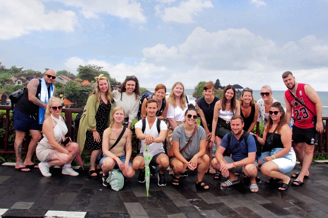 Group of people posing on a sightseeing platform.