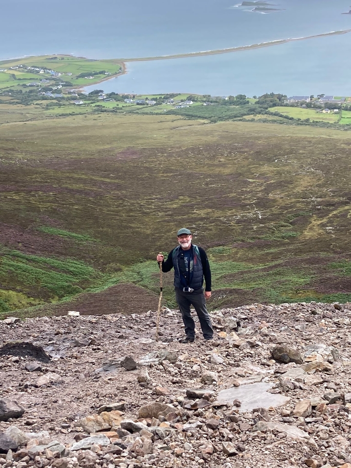 A person hiking in a mountainous area.