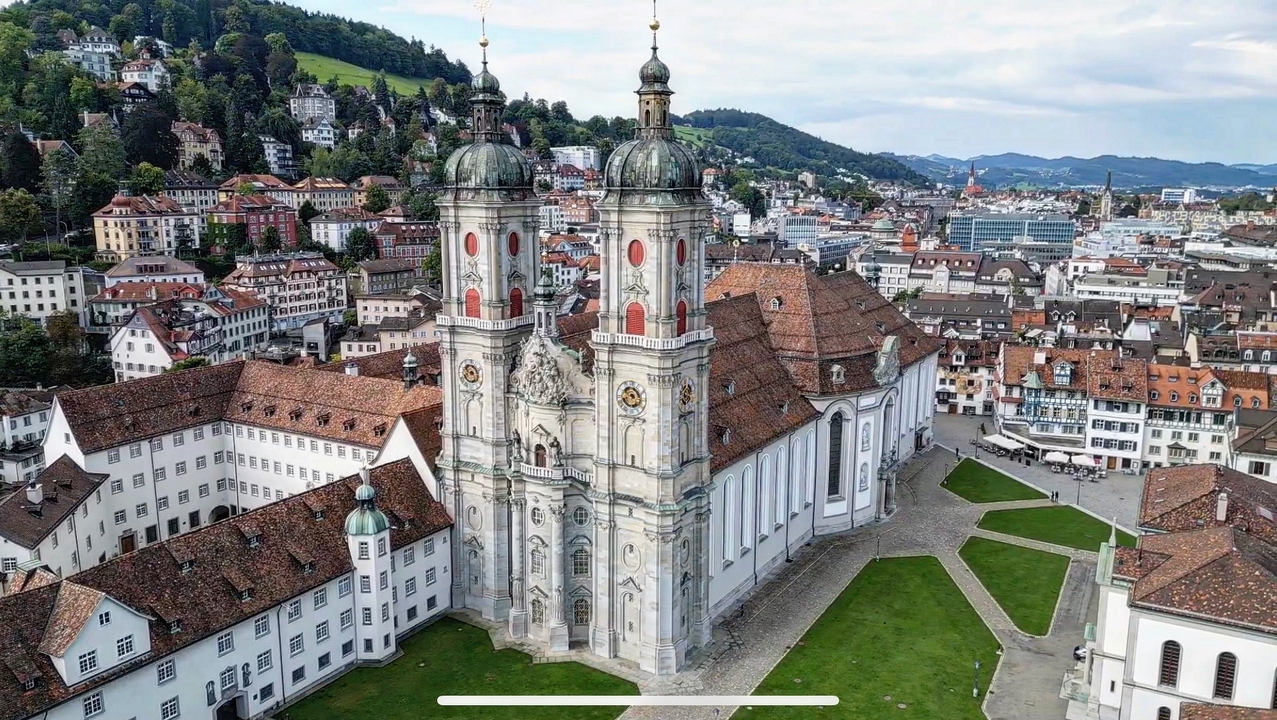 Baroque style cathedral with the city in background.