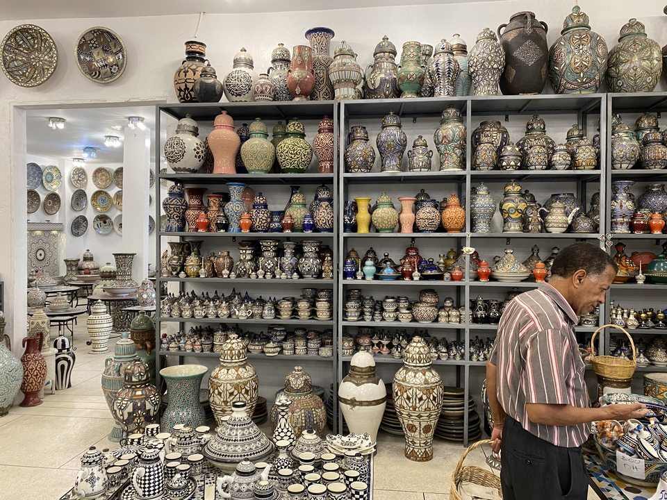 Ornate pottery collection displayed in a shop.