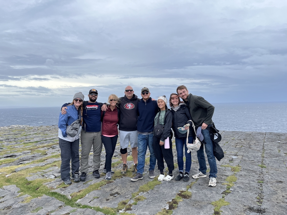 Group photo on a rocky coastal area.