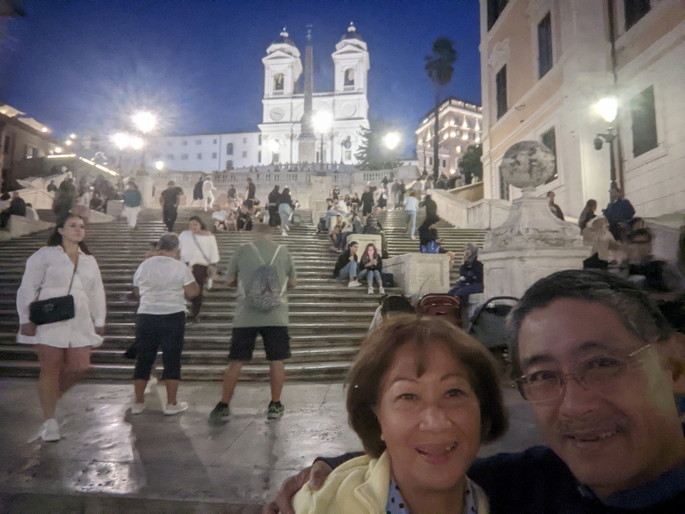 Evening time on a busy staircase with lights.