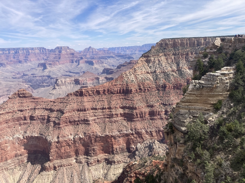 Grand Canyon view with layered rock formations and expansive landscape.