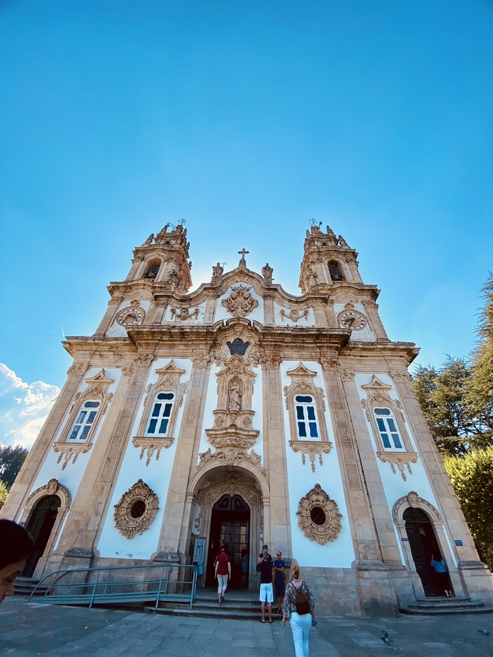 Ornate church facade under a clear sky.