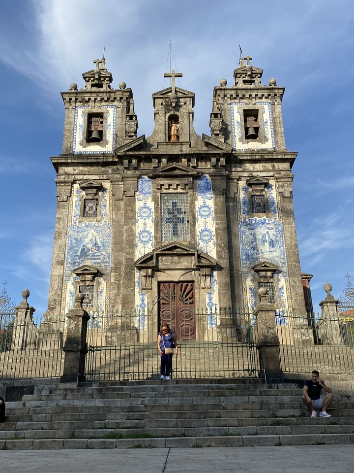 Façade of a historic church adorned with blue tiles.