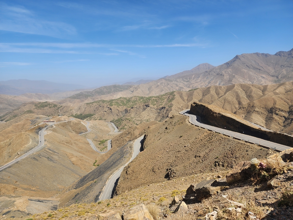 View of a winding road through mountain landscapes.