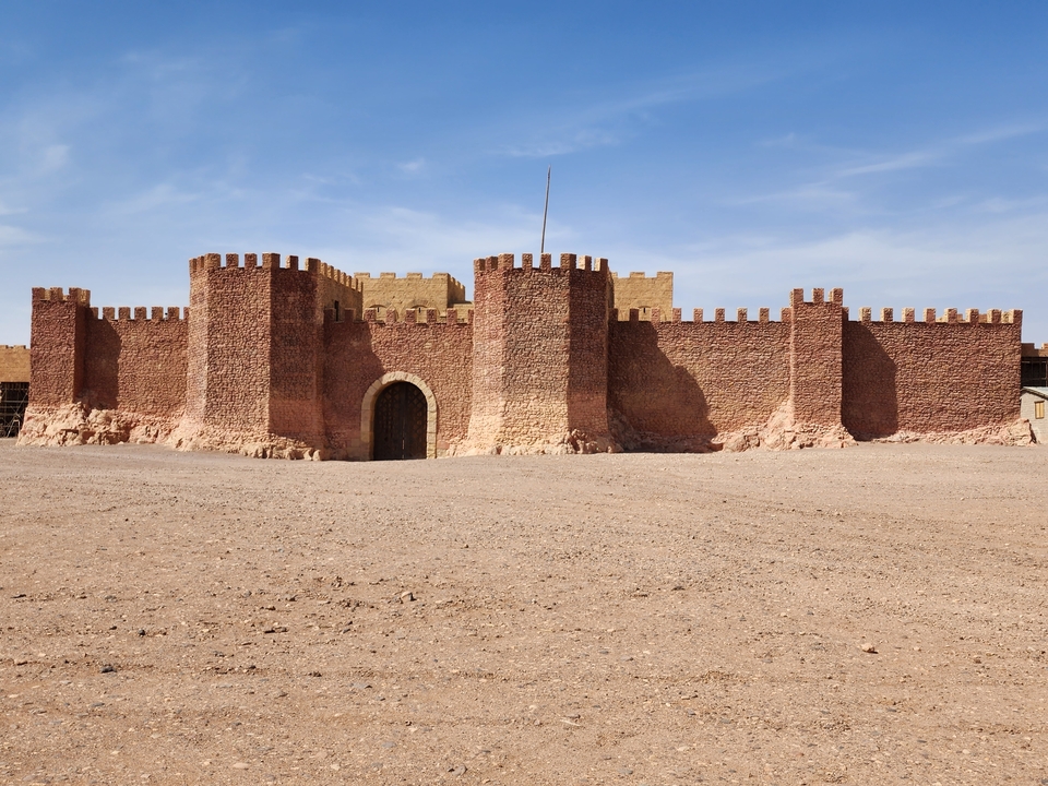 Fortress wall in a desert setting.