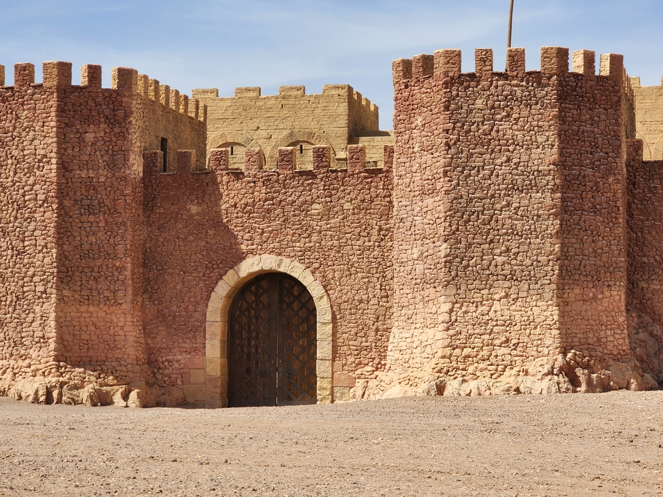 Fortress wall with a central entrance.
