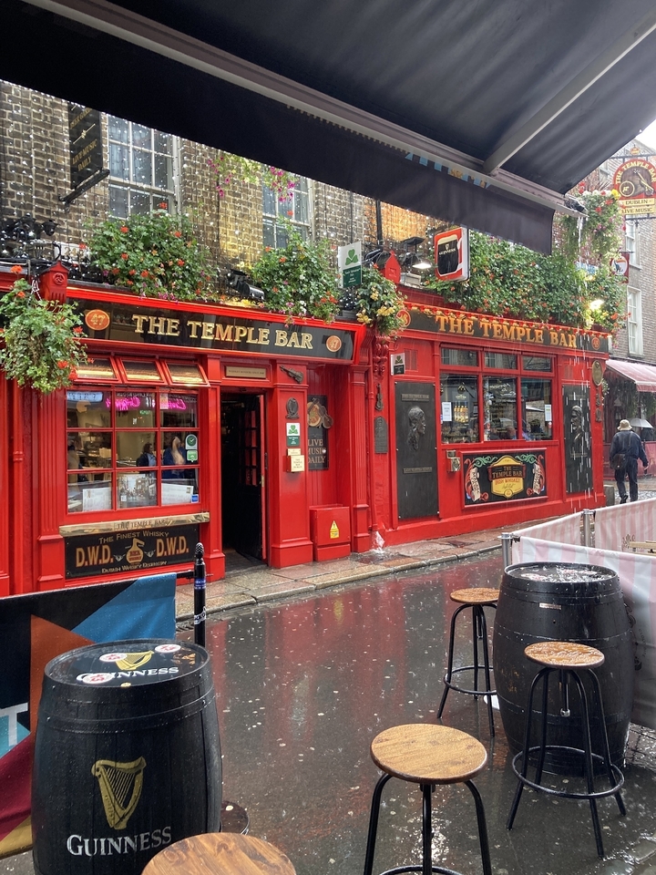 Famous Temple Bar with vibrant red facade in Dublin.